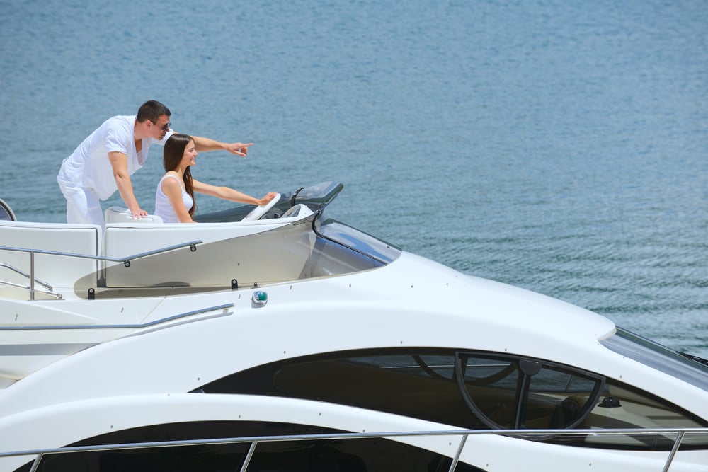 Romantic young couple spending time together and relaxing on yacht Romantic young couple spending time together and relaxing on yacht